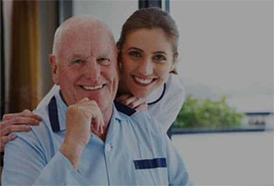Caregiver assisting a senior client with daily personal care