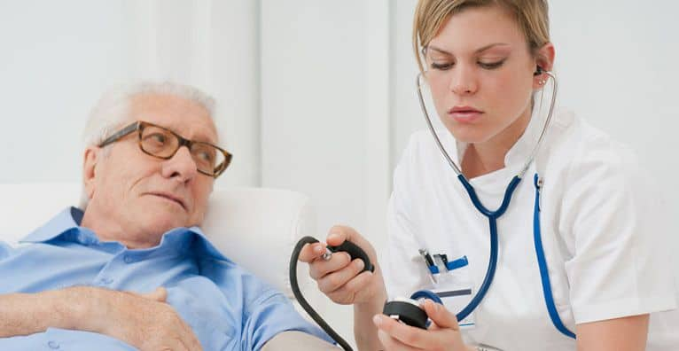 Registered nurse providing skilled nursing care at home