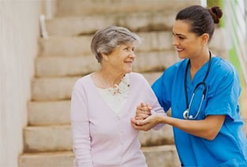 A Registered Nurse reviewing a home care plan with a senior client